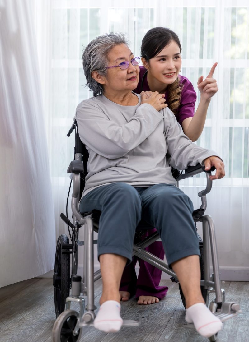 caregiver-nurse-take-care-a-senior-patient-sit-on-wheelchair-nurse-helping-senior-woman.jpg